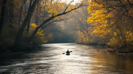 Poster Ein Kajakfahrer auf einem Fluss im Herbst  © Herzog