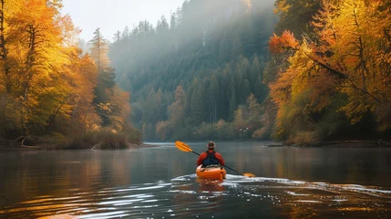 Poster Ein Kajakfahrer auf einem Fluss im Herbst  © Herzog