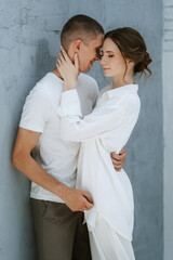 young couple guy and girl in a bright room