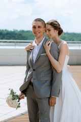 bride and groom first meeting on the roof of skyscraper