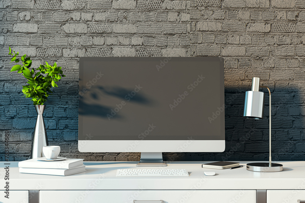 Poster Modern designer desktop with empty computer monitor, lamp, supplies and other items. Black brick wall background. Mock up, 3D Rendering.