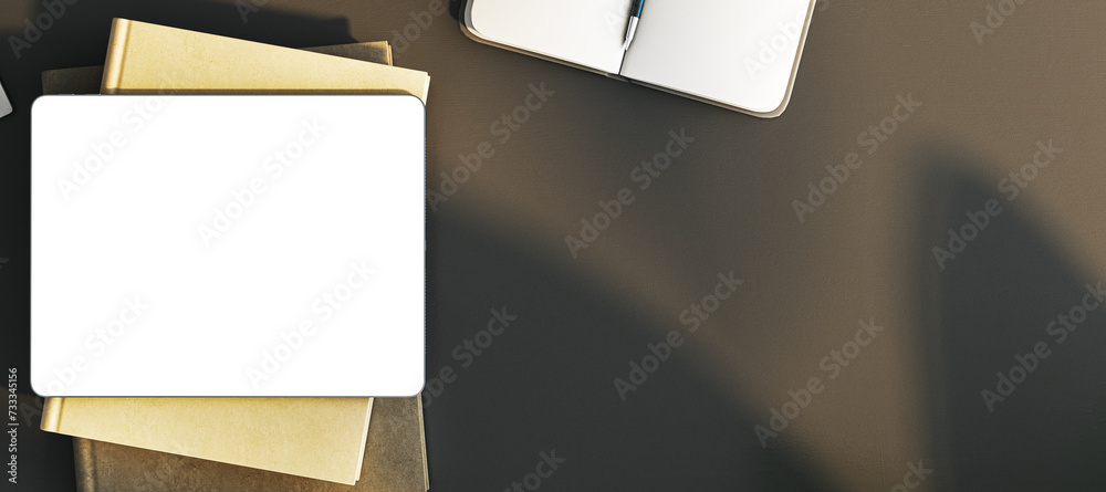 Poster top view of empty white tablet on wide black office desk with supplies and equipment. mock up, 3d re