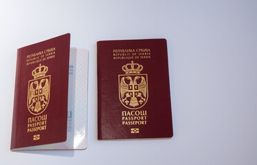 Two Serbian passports on a white background. Top view, Flat lay.