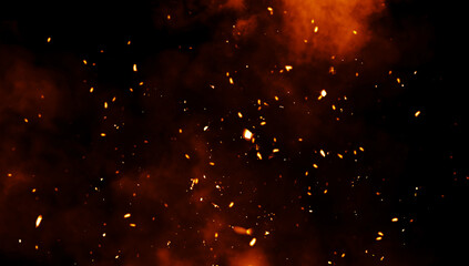 Blurred fire embers sparks on black background . Texture isolated overlays. Concept of particles, sparkles, flame and light.