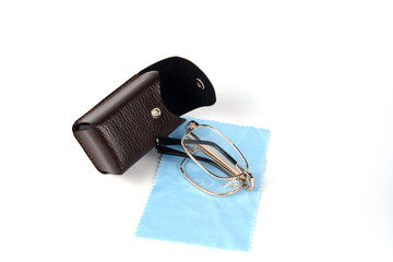 Folding reading glasses with hard case.