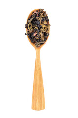Tea with strawberry and passion fruit flavors in a wooden spoon on white background.