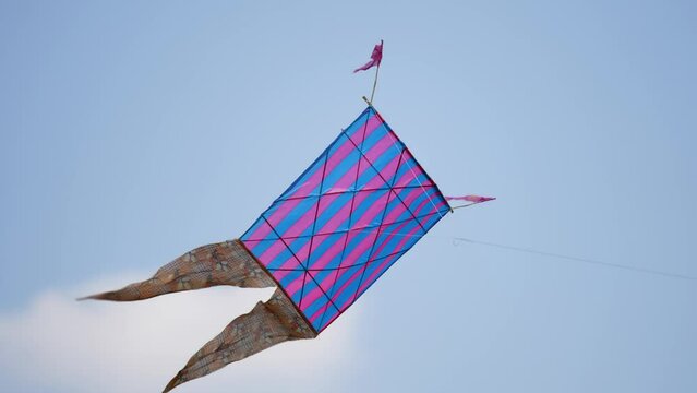 Colorful kite floating on sky