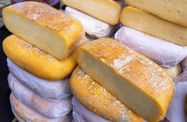 Aged to Perfection: Artisanal Cheeses on Display at a Local Market