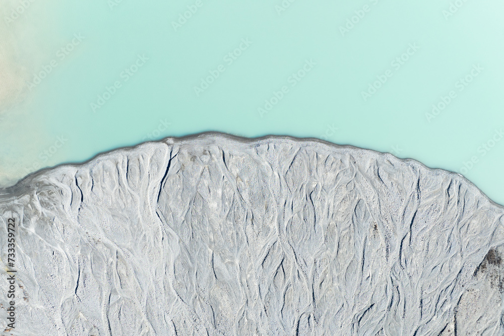 Wall mural drone view of the azure lake in the glacier valley. view of the moraines. landscape from the air. ri