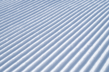 Snow slope for skiing and snowboarding. Velvet. Winter sports. Composition in winter time. Wallpaper and background.