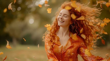 Poster Joyful woman embracing autumn vibes surrounded by golden leaves. casual outdoors photoshoot in fall. lively, cheerful and stylish. perfect image for seasonal themes. AI © Irina Ukrainets