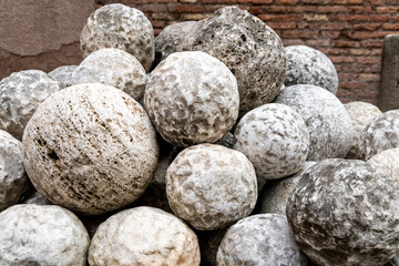 Pile of Ancient Stone Cannonballs from Historical Era