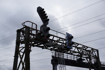 Signal lights on mainline railway line. Train signal lights above tracks 