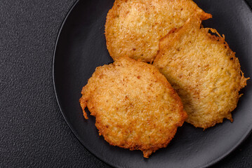 Delicious crispy pancakes made from potatoes, meat, carrots, onions