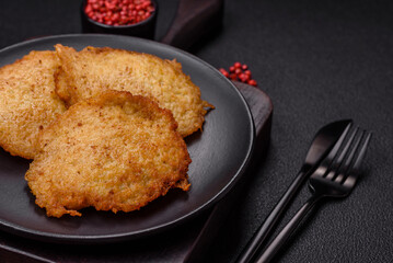 Delicious crispy pancakes made from potatoes, meat, carrots, onions