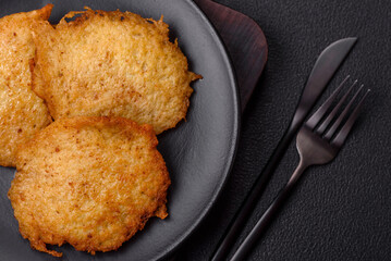 Delicious crispy pancakes made from potatoes, meat, carrots, onions