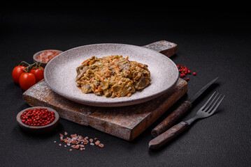 Delicious boiled beef or pork tongue sliced with carrots, onions, sour cream and spices