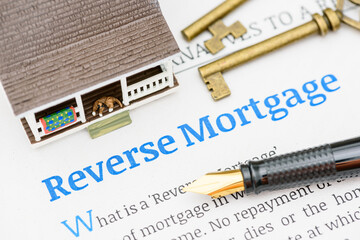 Fountain pen on a reverse mortgage document. A reverse mortgage is a loan for homeowners,...