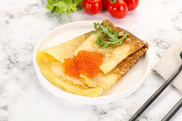 Russian pancake with red caviar