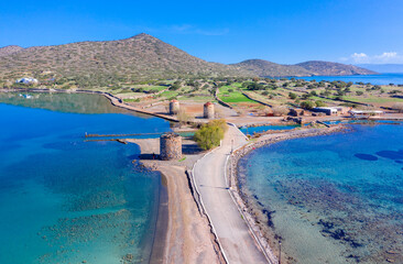Naklejka premium The famous canal of Elounda with the ruins of the old bridge, Crete, Greece.