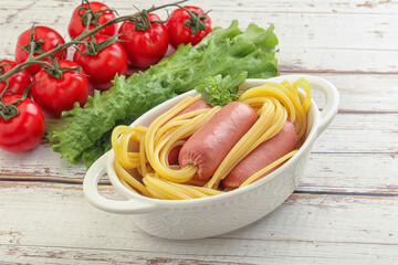 Mini sausages with pasta spaghetti