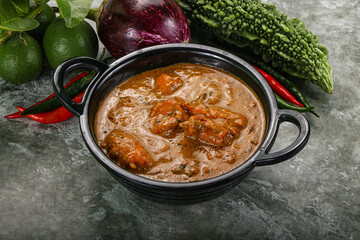 Indian cuisine - chicken curry with spices