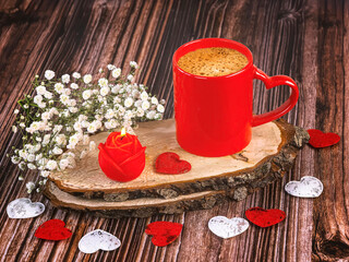 Red cup of coffee with heart, rose candle, gypsophila flowers. Happy Valentine's Day