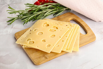 Sliced maasdam cheese with holes