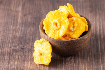 Dried pineapple in a bowl. Dried fruits. 