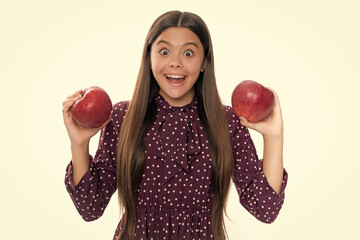 Portrait of confident teen girl with apple going to have healthy snack. Health, nutrition, dieting...