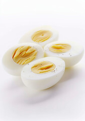 Halved boiled eggs on white
