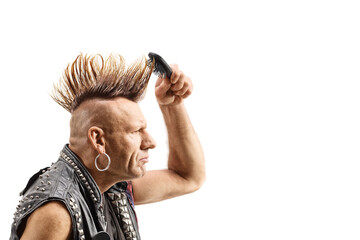 Punk with a mohawk combing his hair