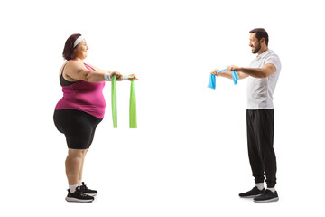 Fitness coach and woman exercising with elastic bands