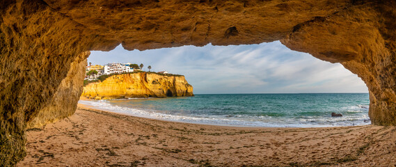 View of Carvoeiro beach from one of its cliff caves, Lagoa, Algarve, Portugal, Picturesque fishing...