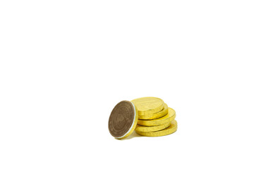 Pile of gold chocolate coins isolated on white background, stack of coins, heap of chocolate money coins