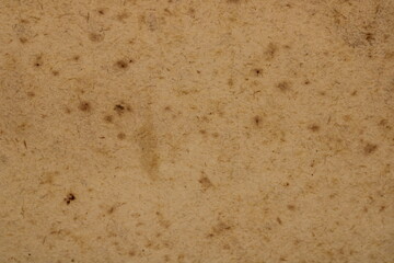 Old battered paper texture or background