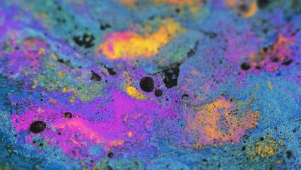 Wet dye background. Pigment fluid. Colorful swirls. Blue purple yellow black shimmering particles...