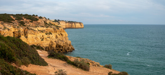 Naklejka premium Algar seco cliffs, caves and tidal pools, Carvoeiro, Lagoa, Algarve, Portugal. Stunning limestone rock formations in the Algarve coast of Portugal