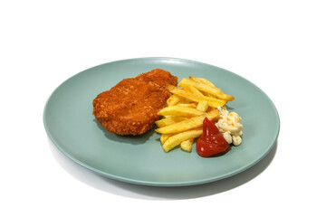 Breaded steak with French fries, topped with ketchup and mayonnaise, served on a turquoise plate. Isolated on a white background.