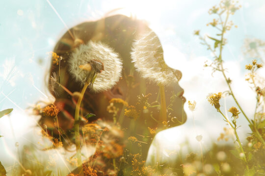 double exposure image of a child's profile filled with a field of wildflowers.