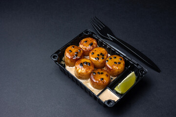 Thai food delivery. scallops on a black background