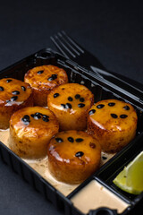 Thai food delivery. scallops on a black background