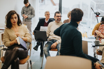 Diverse group of professionals engaged in a creative business workshop.