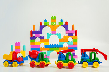 Children's multi-colored plastic construction kit and construction equipment.