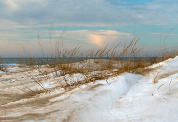 Snowy beach on Lake Michigan USA on a crisp winter's day in January 