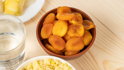 Dried apricots in a clay cup, the concept of healthy and healthy food