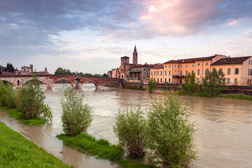 Obraz premium The Adige River overflows in the center of Verona after rains. Veneto, Italy, Europe.