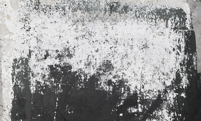 Concrete wall grunge surface with black and white cracked paint. Old concrete wall background. Concrete wall texture with black and white cracked paint. Close up.