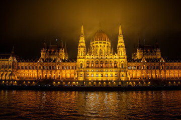 Fototapeta na wymiar Parliament building in Budapest, Hungary at Night. Danube river and City at night