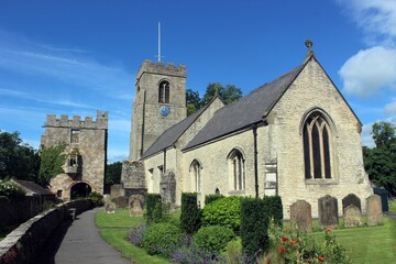 Fototapeta premium Marmion Tower and St Nicholas' Church, West Tanfield, North Yorkshire.